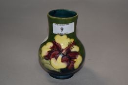 A Moorcroft pottery vase, of baluster form tube-lined in the Hibiscus pattern, faint impressed marks