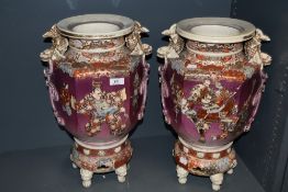 A pair of substantial Japanese Satsuma urns, of hexagonal form decorated with warriors against the