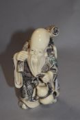 A 20th century cast and carved resin Chinese immortal, possibly Zhang Guolao 12cm