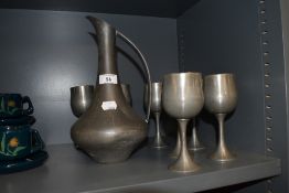 A Selango Pewter ewer and eight goblets, marks to underside