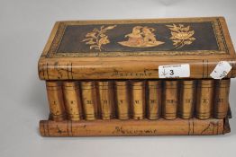 A late Victorian Italian Sorrento ware puzzle box in the form of library books.