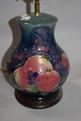 A Moorcroft Pottery 'Blue Finches' pattern baluster form table lamp, tube-lined with Birds and fruit