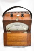 A mid century wooden cased voltmeter, G.E.C made in England.
