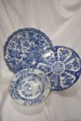 Three antique blue and white oriental plates, AF.