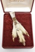 A vintage rabbits paw, having engraved thistle to silver plated mount.