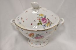 A substantial early 20th century punch bowl, having floral transfer pattern, moulded shell handle