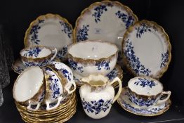 A selection of Victorian table ware, having blue floral pattern on white ground with gilt