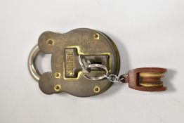 A large vintage brass Squire pad lock, with key.