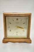 A mid century wood and brass cased mantel clock, having bevelled glass to front, An Elliot clock,