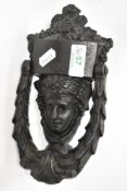A George III Neo-Classical design cast-iron door knocker in the form a maiden's bust