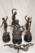 A collection of antique spelter figurines and a modern resin ballerina, AF.