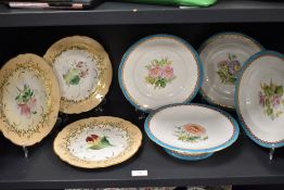 Six Victorian paltes and a tazza, having hand painted floral decorations to the centres and gilt