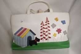A Radley handbag, having flowers, kennel and Scotty dog to front.