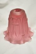 A late 19th/ early 20th century cranberry glass lamp shade, of fluted form, having Macintosh style