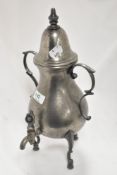 An early 20th century pewter samovar tea pot in a Gothic design on tripod base.