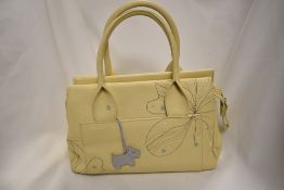A Radley handbag, having yellow ground, with embroidered flowers front.