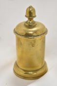 A Brass trench art tobacco jar formed from a shell casing, having heavy lead internal lid.