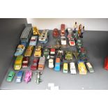 A collection of payworn diecasts including Corgi, Dinky, Lesney etc along with four wooden figures