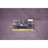 A Dinky diecast, 152 Rolls Royce Phantom V Limousine in dark blue with cream interior, on card stand