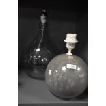 Two modern hand blown glass lamps including a mottled glass ball and tear drop design.