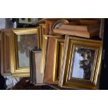 A large collection of small pictures and frames.