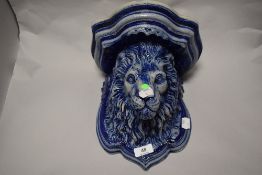 A Rhenish pottery salt glazed lion head wall bracket.