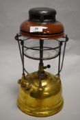 A 1930s/40s brass and enamel Tilley lamp.