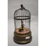 A mid to late 20th century Swiss made Reuge Music automaton bird cage, having two birds which sing