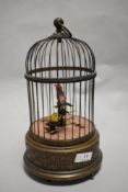A mid to late 20th century Swiss made Reuge Music automaton bird cage, having two birds which sing