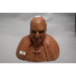 A terracotta bust of a clergyman.