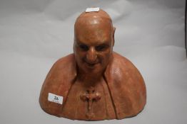 A terracotta bust of a clergyman.