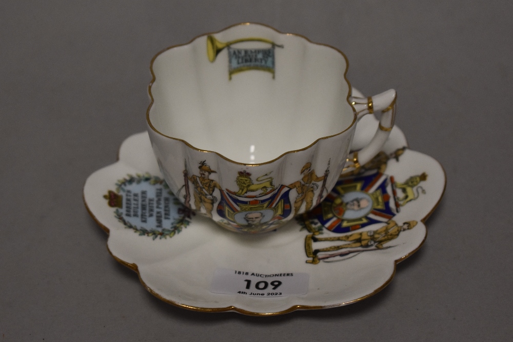 A collectable cup and saucer ' Colonies supporters of the Empire volunteers to swag below