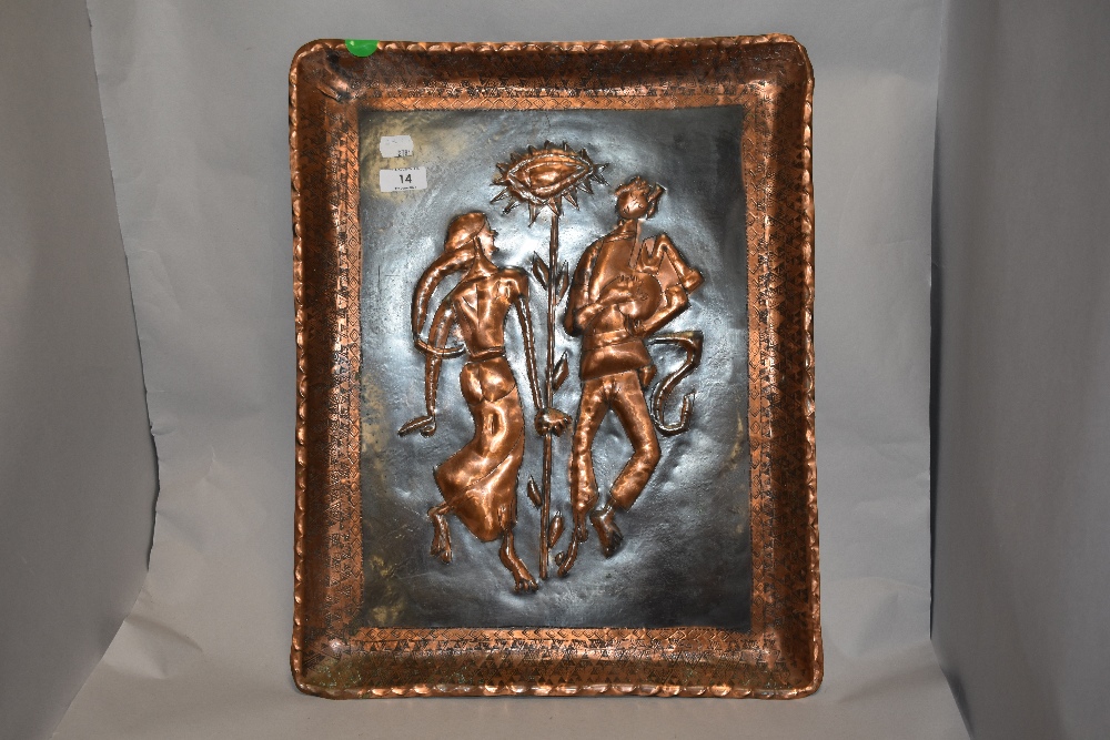 An embossed and etched copper wall plaque, depicting traditionally attired figures to centre.