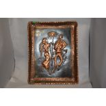 An embossed and etched copper wall plaque, depicting traditionally attired figures to centre.