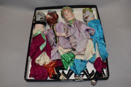 Four traditional Chinese puppets, having painted clay heads, feet and hands, AF, wear to some