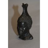 A small cast resin bronze effect traditional African bust.