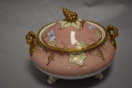 A modern Royal Crown Derby lidded tureen having pink, white and gilt design with grape vine