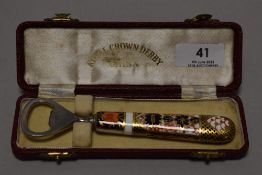 A vintage Royal Crown Derby bottle opener in the Imari palette, with presentation box.