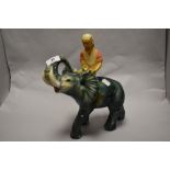 A 1930s Art Deco chalkware elephant and rider.