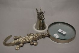 An English pewter cup, having hare head with antlers, sold with a magnifying glass with alligator