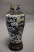 An 19th century Chinese export blue and white crackle glaze vase decorated with twin dragons and sky