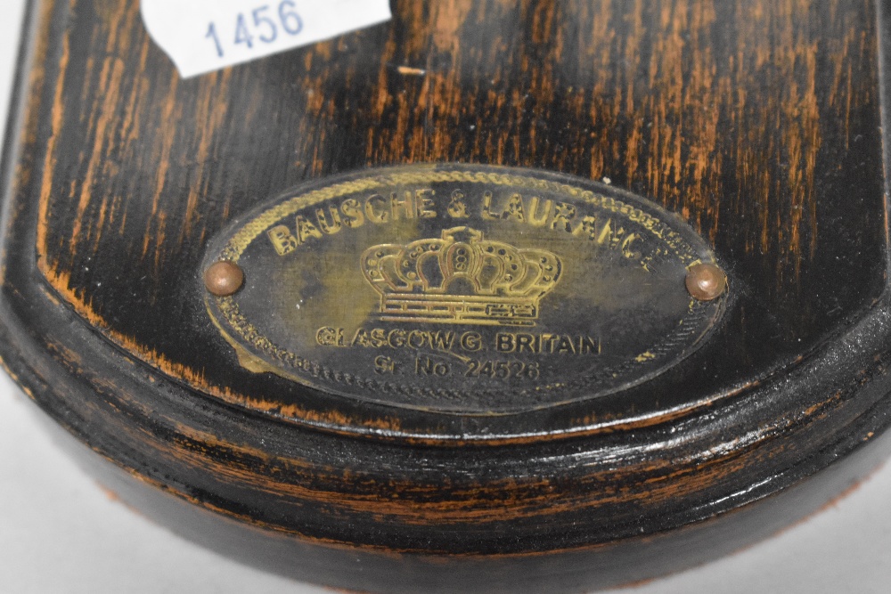 An early 20th century desk top magnifying glass on wood plinth, with metal label for Bausche and - Image 2 of 2