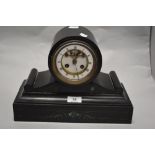 A Victorian black marble mantel clock, having etched scroll detail and green natural stone inset