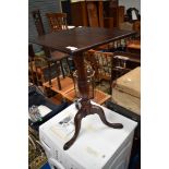 A 19th Century mahogany occasional pedestal table having turned column and triple splay legs