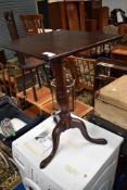 A 19th Century mahogany occasional pedestal table having turned column and triple splay legs