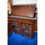 An early 20th Century Regency revival style bureau bookcase, with astral glazed section (glass af)