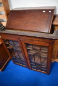 An early 20th Century Regency revival style bureau bookcase, with astral glazed section (glass af)