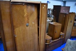 An early to mid 20th Century oak bedroom suite