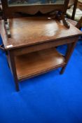 An early 20th Century oak occasional table with drawer and undershelf