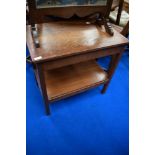 An early 20th Century oak occasional table with drawer and undershelf